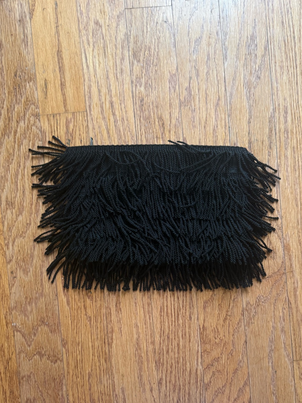 Emerson Fry fringe clutch bag with top zip closure and interior pocket